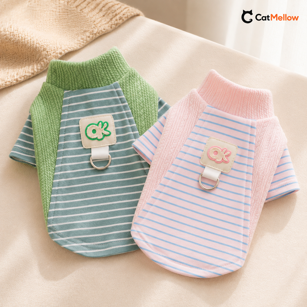 Green and pink CatMellow pastel stripe knit cat shirts arranged together.