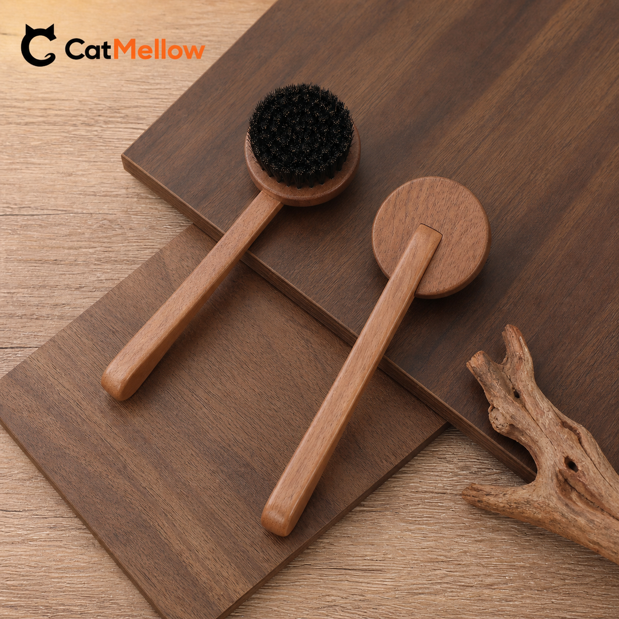 Two unbranded walnut cat brushes arranged on layered walnut boards