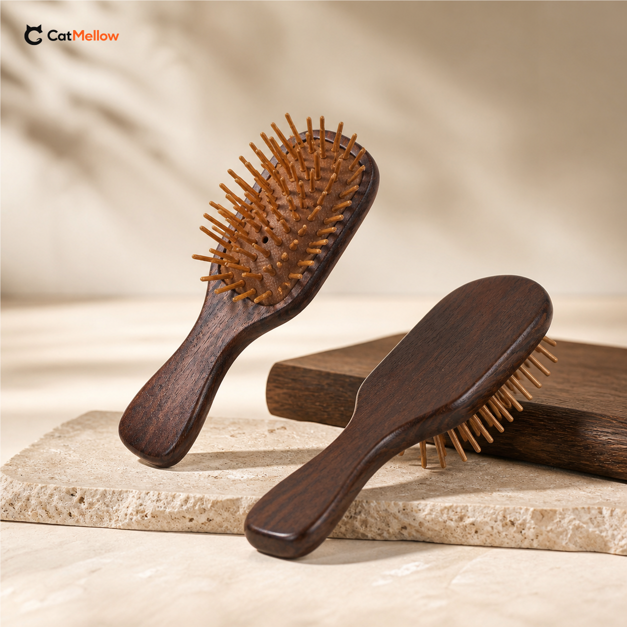 Mini Bamboo Pin Cat Brush on a warm neutral background, showing the dark wood handle and rounded bamboo pins.