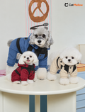 Three dogs in blue, red and beige hooded four-leg dog snowsuits.
