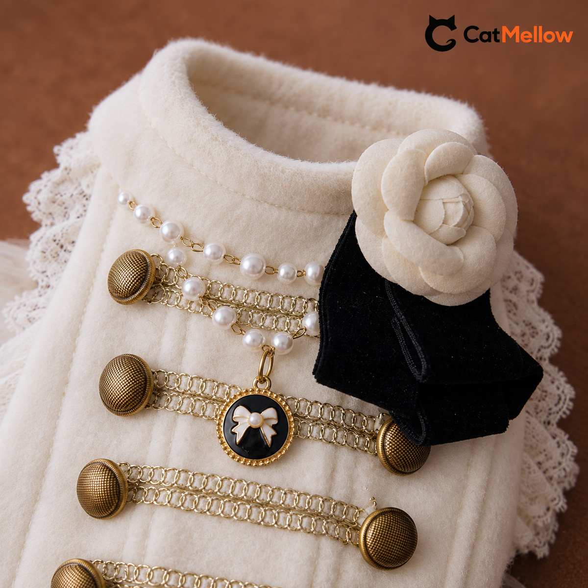 Ivory flower and black ribbon corsage, pearl-look accents and gold-tone trim.