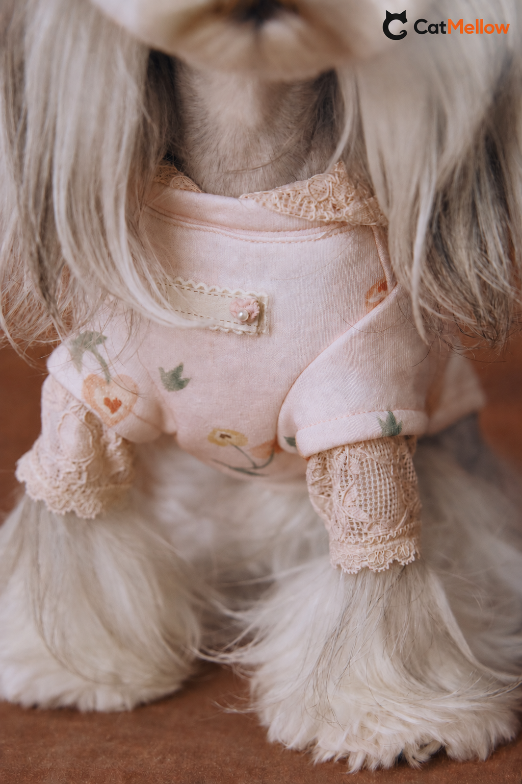 Pink hoodie neckline and lace cuff detail