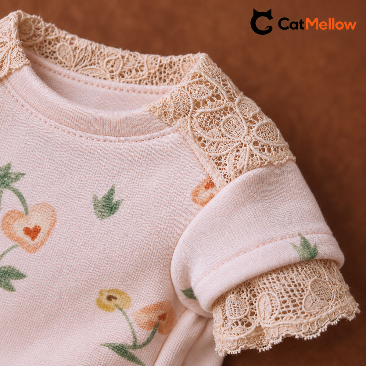 Pink fabric neckline and cream lace detail