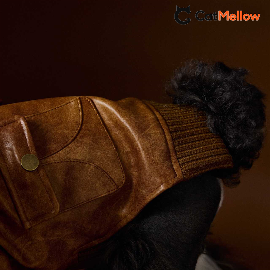 Close-up of brown jacket back pocket and ribbed hem
